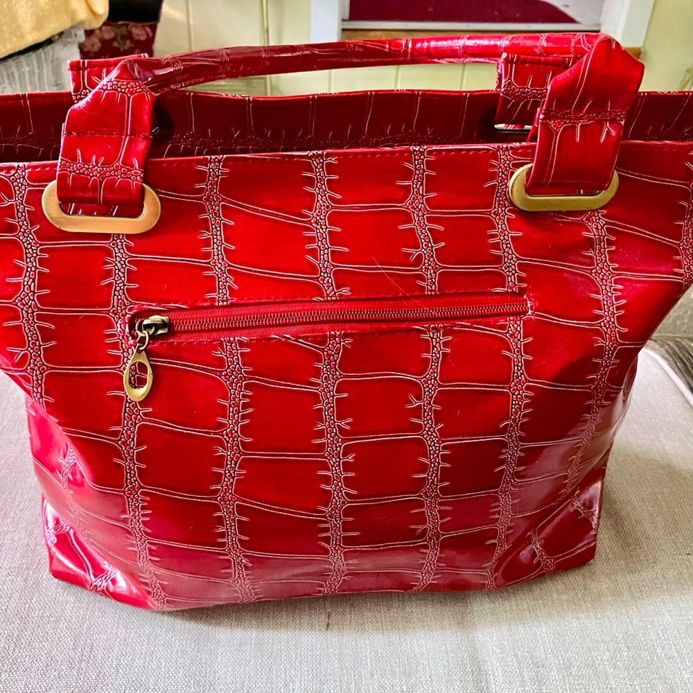 LIKE NEW! Red Embossed Double Handled Purse with gold accents.